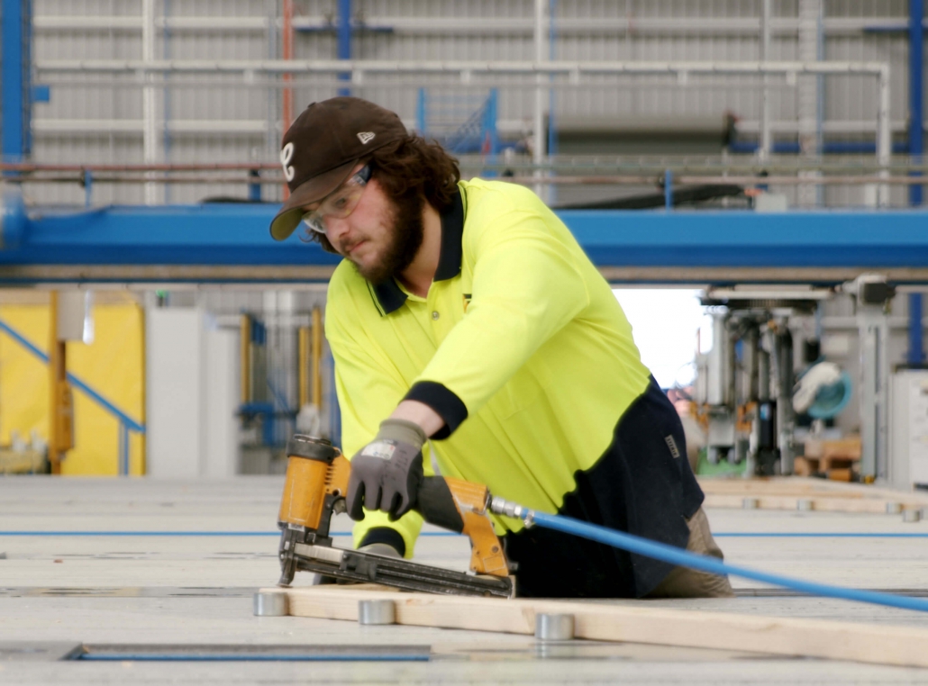Employee works in Timbertruss with safety gears