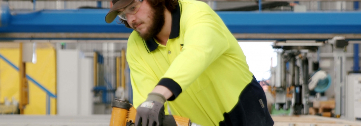 Employee works in Timbertruss with safety gears